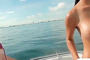 Two sexy girls enjoyed foursome action on speed boat