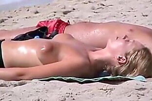 - Beach topless girl expose puffy nipples
