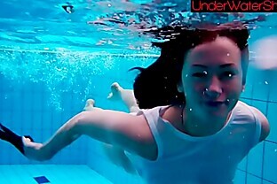 Perfect shaved teen in the pool