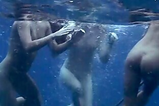 Three girls swimming nude in the sea