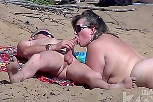 Blowjob on a nudist beach