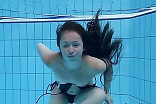 Cute Umora is swimming nude in the pool 7 min